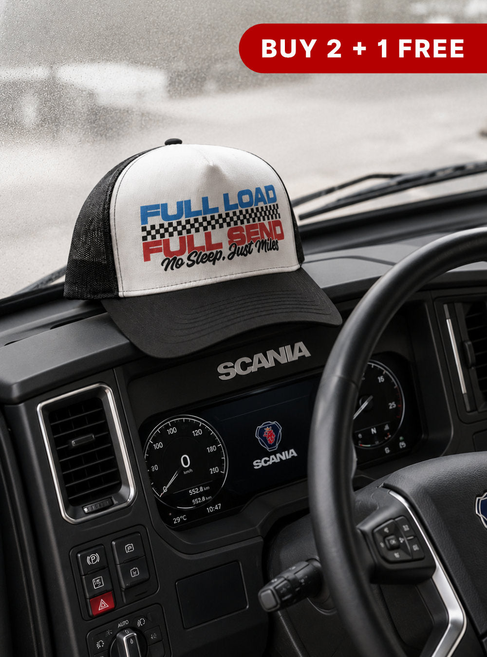Trucker hat with motivational text on a Scania vehicle dashboard