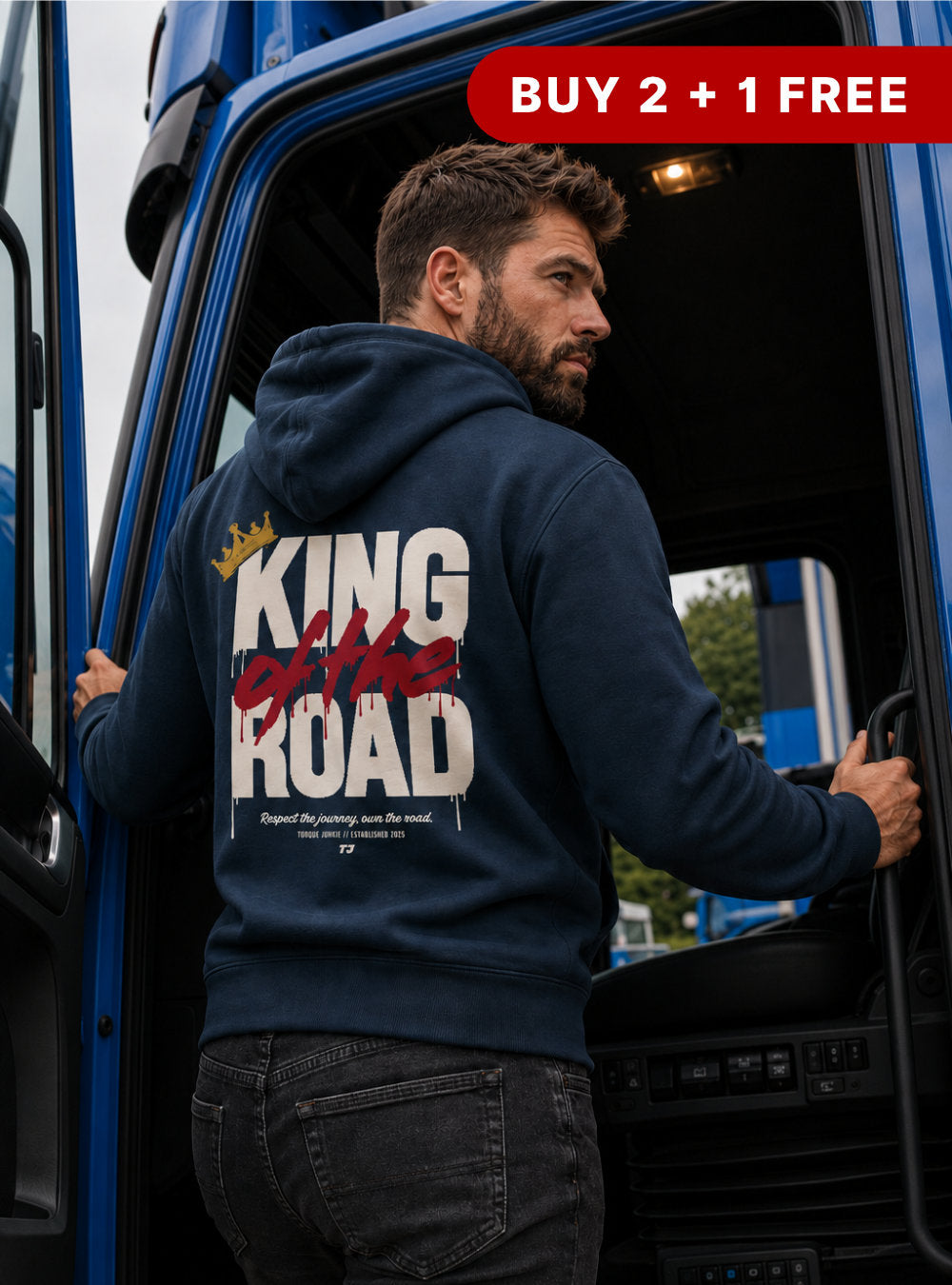 Man wearing a hoodie with 'King of the Road' text, standing next to a truck with promotional text above.